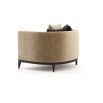 A luxurious and cosy armchair with velvet upholstery and blind tufted details