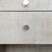 A contemporary bedside table with Raffia upholstery.