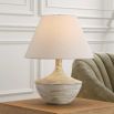 Table lamp with natural style curvaceous base and cream shade
