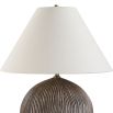 Illuminate your space with the Sayre Table Lamp, featuring a textured porcelain base in dark brown and a chic oatmeal linen shade for timeless elegance.