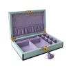 Striking eye-design jewellery box in pastel blue with lilac velvet interior and brass accents