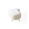 Organic shaped upholstered ottoman with tapered brass legs