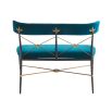 Striking bench with blue velvet finish and brass accents with floral motifs