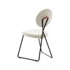 Stylish dining chair upholstered in white fabric with a sleek black frame