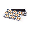 A funky bowtie box by Jonathan Adler with a 60s-inspired graphic design 