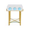 Futuristic side table with blue orb detail and polished brass finish