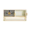 Modernist inspired poppy sideboard with brass accents and black and white pattern
