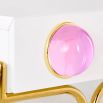 Glamorous console table with two storage drawers, gold legs and pink acrylic orbs