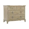 A 4 drawer bedside table in a sand finish
