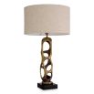 Brass structure table lamp with hole details and linen shade