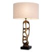 Brass structure table lamp with hole details and linen shade