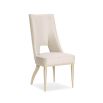 Neutral upholstered dining room chair with peak-through lower back