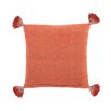 Luxuriously cosy orange cushion with orange tassels 