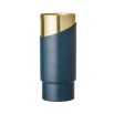 A stylish blue metal and golden aluminium vase