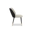 Elegant dining chairs with light grey velvet upholstery and quilted dark grey back