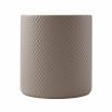 Timeless round dining table with grey, diamond-quilted leather back and brass accents