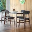 Retro inspired dining chair with grey fabric and walnut stained wooden frame