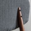 Retro inspired dining chair with grey fabric and walnut stained wooden frame