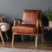 Mid-century style armchair with modern silhouette and brown leather upholstery