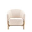 Sumptuous upholstered armchair with curved back and natural wooden legs