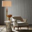 Elegant beige marble side table with slighly hourglass shaped plinth base and round top