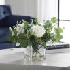 Faux potted roses in square glass vase
