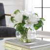 Artificial plant in vase with faux water.
