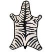 A playful and colourful flatweave rug with a vibrant zebra print