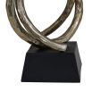 Captivating lasso sculpture with entwines gold shape mounted on a sleek black base