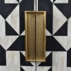 Geometric, black and white pattern drinks cabinet with gold accents