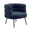 A beautiful blue bouclé upholstered armchair with a deep curved silhouette and metallic legs 