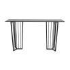 Black metal console table with geometric legs and tinted glass top
