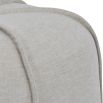 Upholstered neutral linen stool with exposed piping