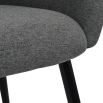 curvaceous and dark grey upholstered dining chair 