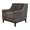 Cosy armchair with deep buttoning on the backrest and grey upholstery