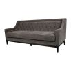 Luxury grey sofa with deep studding details and curved arms