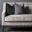 Luxury grey sofa with deep studding details and curved arms