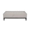 Simple ottoman with deep buttoning details on the seat