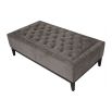 Elegant ottoman with deep buttoning detail on the seat