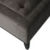 Elegant ottoman with deep buttoning detail on the seat