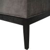 Elegant ottoman with deep buttoning detail on the seat