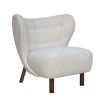 boucle cream chair with sweeping back and natural lustre