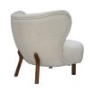 boucle cream chair with sweeping back and natural lustre