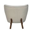 boucle cream chair with sweeping back and natural lustre