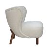 boucle cream chair with sweeping back and natural lustre