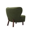 stunning boucle green armchair with sweeping back