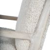 wooly upholstered armchair with washed wood frame