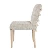 textured upholstered dining chair with tassel details and washed wood legs