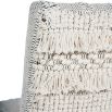 textured upholstered dining chair with tassel details and washed wood legs