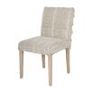 textured upholstered dining chair with tassel details and washed wood legs